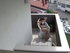 Spying my teenager neighbour tugging on her balcony