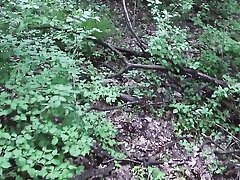 Spying a mind-blowing woman masturbating in the woods