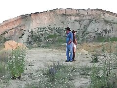 Cowboy lovemaking on the hill background